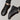 Men's black leather fur-lined waterproof winter sneakers with a rugged design, featuring durable synthetic rubber soles suitable for outdoor activities.