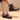 Men's black waterproof leather ankle boots designed for thermal insulation and slip resistance, shown on a model's foot, showcasing stylish and functional footwear suitable for various weather conditions.