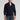 Men's blue cable knit zip-up sweater featuring ribbed trim details, worn by a model with the sweater partially unzipped to reveal a contrasting dress shirt underneath. The sweater showcases long sleeves and a high collar, suitable for winter fashion.