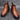Men's brown leather Chelsea boots in a slip-on ankle design, showcased in a still life setting highlighting the durable material and fashionable style.