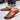 Brown leather sandals with a casual design, featuring a breathable and lightweight slip-on style for men.