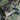 Men's durable military camo style jacket with camouflage pattern in grey and khaki colors, featuring a collar and long sleeves, designed for tactical outerwear use.