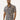 Men's Floral Print Short Sleeve Shirt in a Tropical Summer Button-Up style, featuring a grey collar and sleeves. Model with beard and styled hair.