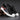 Men's grey slip-on sneakers with red accents, designed for athletic use and outdoor activities, featuring a comfortable and stylish fit ideal for walking, running, or cross-training.