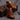 Men's luxury sneakers in orange leather with a BF branded quilted design, shown in a brown color variant, featuring athletic and walking shoe style with sportswear appeal.