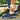 Men's navy waterproof slip-on walking shoes on a grass surface, featuring lightweight and anti-slip design, worn with denim pants.