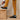 Men's orthopedic tan leather slip-on clogs for casual and work wear displayed on a wooden floor, emphasizing comfort and joint support.