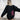 Men's oversized black fleece hoodie in size 4XL, showcasing its loose fit and thick material, suitable for winter. The hoodie is worn by a person, highlighting the shoulder and sleeve details against a neutral background.