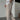 Men's slim fit beige pinstripe trousers styled for summer fashion, highlighting the elegant leg fit and lightweight fabric.