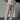 Men's slim fit beige pinstripe trousers showcasing lightweight summer fashion, emphasizing the tailored fit through the leg, waist, and thigh areas.