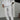 Men's slim fit beige pinstripe trousers paired with a white dress shirt, featuring a lightweight design suitable for summer fashion.
