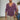 A man wearing a purple slim fit V-neck thermal knit sweater in an earth tone, showcasing its stylish design with long sleeves and a snug fit around the waist.