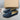 Men's tan suede loafers featuring contrast stitching, displayed as a comfortable slip-on shoe on a wooden surface, highlighting their fashion-forward design.