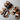 Men's two-tone leather sandals featuring an adjustable strap and a cork sole, primarily in shades of brown and beige.