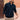 Men's white ribbed half-zip sweater with a casual and lightweight design, featuring long sleeves and a high collar. The sweater is being worn by a model with a beard, showcasing the fit and texture of the knitwear around the shoulders and neck.