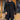 Men's double-breasted black wool blend overcoat, featuring a formal design with a classic frock coat style, suitable for standing and showcasing elegant fashion.