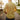 Men's yellow linen shirt with tailored fit, featuring a classic collar, button-down front, and long sleeves, displayed on a mannequin or model standing outdoors near plants and grass, highlighting the lightweight and breathable fabric.