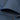 Minimalist dark blue men's bomber jacket with a sleek design, featuring a collar and long sleeves, showcasing a lightweight urban fashion style.