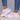Multicolor women's breathable lightweight athletic sneakers featuring a purple and azure design, shown being worn on a human leg.