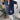 Navy blue shirt dress for women, suitable for summer casual wear, displayed on a mannequin with emphasis on shoulder and neck design, surrounded by a minimalistic background including a small flowerpot.