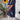 Navy blue shirt dress designed for casual summer wear, featuring long sleeves and a defined waist, modeled by a woman standing outdoors.