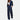 Navy blue women's pinstripe suit featuring a blazer and high-waisted trousers, styled with a dress shirt, ideal for professional workwear settings.