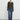 Navy bouclé jacket for women, featuring a chunky knit texture, styled as a winter cardigan. The jacket showcases a tailored fit with long sleeves, shoulder details, and a combination of casual and elegant elements, suitable for pairing with jeans or dress pants.