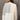 Neutral tone color-block sweater featuring long sleeves and a cozy knit design perfect for fall, with a stylish combination of grey and other muted tones that enhance its trendy and versatile look.