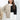 Neutral tone color-block sweater worn by a woman, featuring long sleeves and a trendy, stylish design suitable for fall.