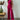 Neutral tone women's elegant fall outfit featuring a ribbed sweater with long sleeves and matching trousers.