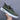 Olive green low-top men's urban casual sneakers made from breathable canvas, featuring a simple design suitable for everyday wear.