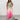 Ombre pleated maxi dress in sunset pink and green, featuring a halter neckline, sleeveless design, and elegant flowing silhouette, shown on a model smiling and wearing a size 4XL.