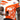 Men's urban style t-shirt featuring a bold orange lion graphic, with short sleeves and a fashion-forward design. The tee is primarily white with black accents, offering a sporty and stylish look suitable for casual outings.