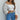 White off-shoulder puff sleeve crop top for women, designed for summer fashion.