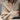 Oversized beige chunky knit women's cardigan featuring long sleeves and a cozy collar, perfect for winter fashion.