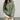 A light green oversized sweatshirt for women, featuring a casual loose fit with long sleeves and a comfortable neckline, suitable for plus size 2XL.