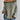 Oversized green striped knit sweater featuring a cozy boat neck design in size 2XL, worn by a person with visible arms, shoulders, and hair.