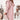 Oversized pink hooded sweater dress featuring a chunky knit design, ideal for winter fashion, with long sleeves and a comfortable fit.