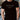 A person wearing a pale yellow unisex t-shirt made of breathable cotton with short sleeves. The individual has a beard and is showing their shoulder, neck, and part of a black watch. The variant displayed is black in size 2XL.