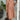 Women's casual peach mid-length spring dress in persimmon shade, size 3XL, featuring lightweight and elegant design, displayed on a model wearing glasses and smiling, with a houseplant and flowerpot in the background.