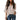 A woman wearing a pink chiffon V-neck blouse with batwing sleeves and a loose fit, suitable for summer. The blouse is paired with jeans. The top is in a beige color and is a 3XL size, highlighting comfortable and stylish summer wear.