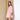 Pink corduroy A-line shirt dress with ruffled sleeves and a mini length, featuring a collar and fitted waist, modeled by a smiling woman.