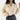 A beige cropped V-neck blouse with puffed sleeves, designed for a casual chic style. The blouse is displayed on a mannequin, highlighting the short sleeves that puff slightly at the shoulders and the tailored fit around the waist.