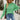A stylish green textured ribbed sweater featuring a cut-out design, displayed in an extra-large size, showcasing modern knitwear with a focus on the shoulder and neck areas.