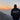 Pink tie-dye hoodie with the words "Self-Love" printed on the front against a backdrop of a serene mountain landscape during sunrise.