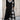 Plaid long-sleeve midi dress featuring a cowl neck and contrast hem, showcasing a stylish black and white design suitable for daytime fashion.