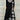 Plaid long-sleeve midi dress featuring a cowl neck and contrast hem, combining black and white plaid pattern with tailored waist for a stylish day dress look.
