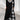 Plaid long-sleeve midi dress featuring a cowl neck, black and white color scheme, and a contrast hem.