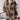 A women's oversized brown plaid teddy coat displayed against a plain background, showcasing its thick, warm textile suitable for winter outerwear. The coat features a tartan pattern with shades of beige and white, offering a stylish and cozy fashion option.