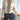 Vintage-styled V-neck pleated blouse with ribbon detail, featuring long sleeves and a chic design.